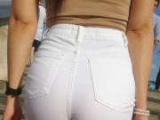 Round ass in a white seethrough short