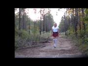 School girl walk out in the woods
