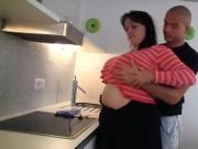 Horny guy fucks busty plumper at the kitchen