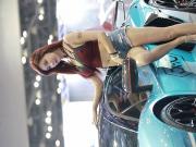 hot Korean girl at a motor show in clear high heels