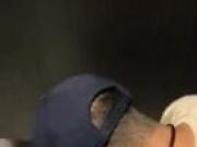 YOUNG GUY PLAYING IN THE RESTROOM.