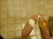 Pink stiletto high heels, nylons, cream and eggs food mess