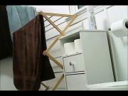 Two Friends Using Bathroom