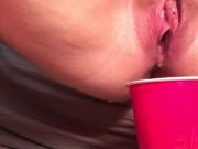 Evelle pissing in red cup
