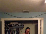 Super cute teen puts on a shirt in her room