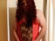 Transvestite Marcella cumming in red lingerie.