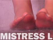 Mistress Leg washing nylon feet from the chocolate topping