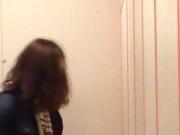 Long haired guy pissing at urinals
