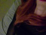 Redhead in black thigh highs fucks herself!