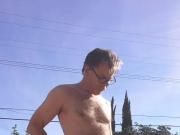 Amateur standing fully naked jerking off in backyard