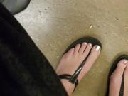 Candid feet in thong sandals