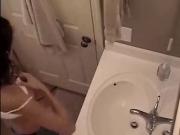 Cute girl masturbates in bathroom