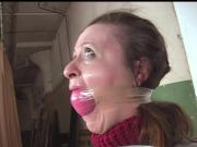 Helplessly bound and gagged woman