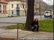 Mature redhead taking a piss in a public park