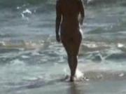 Girls breasts exposed on beach