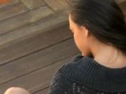 woman rubbing the clit behind the house