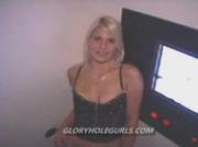 Blonde slut sucking anonymous cocks in a dirty gloryhole booth