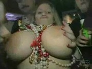Busty girl shows boobs at Mardi Gras