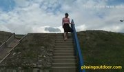 Girl pisses on the steps