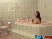 Pregnant lesbian couple enjoying bathtub fingering session