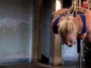 Hogtied and suspended blonde slave