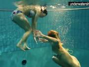 Two sexy amateurs showing their bodies off under water