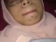 Young veiled Pakistani woman enjoying practice