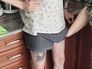 sperm flows powerfully from the penis after it has been jerked off by a fat woman