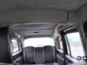 Blonde in fishnet pantyhose in fake taxi