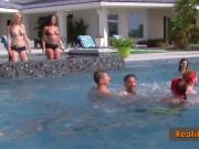 Couples play at the pool as they get ready to party in the red room