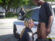 Busty and horny female cops love to suck a big black pecker behind the patrol, this guy is officiall