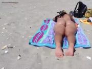 Big ass MILF naked on a beach