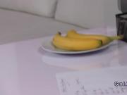 Female agent plays with banana and cock