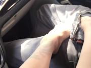 Milf gives public footjob in car