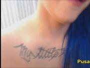 Closeup Squirt Blue Hair Punk Teen With Tattoos and Glasses