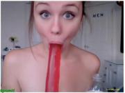 Redhead teen deepthroats huge dildo