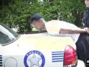 Tattooed cop gets fucked by black dude with massive cock in a threesome with anoth...