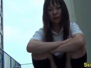 Little asian teen rubs herself