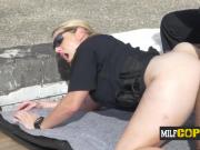 A naughty MILF is banging on the rooftop with a black criminal and his huge cock.