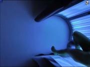 Blonde fingering herself in solarium