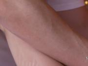Oiled brunette got pussy rubbed by masseur