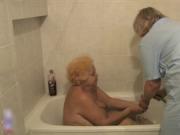 Nasty old lady gets her cunt and ass rubbed in the show