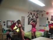 College girls playing dress up in dorm room