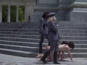 Two naked slave made to crawl in public