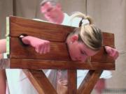 Cute blonde caned in a guillotine by elitespanker