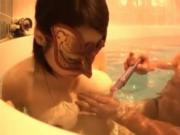 Sexy asian girl wears a mask in a swimming pool, she sh