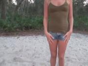 Good looking blond woman shows her breasts and torso in