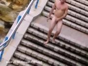 Nude guy walks around women by public beach