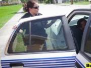 Two white police officers riding black suspect in publi