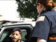 Two cops playing with black dick